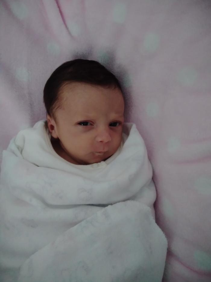 My daughter (8 days) is doing this angry face to me since day 2. Should i be worried? it' s my first baby...