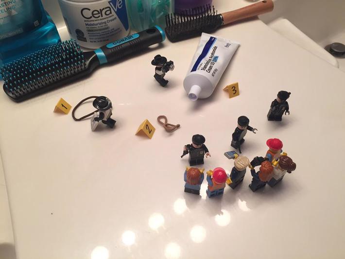 My brother cleaned and organized our bathroom while I was away last week. Last night I accidentally left some things out, so he set this little scene up with his Legos