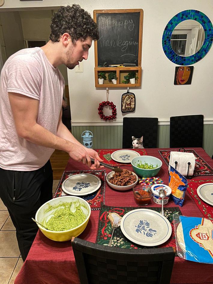 My friend’s cat waited politely to be served steak at dinner tonight