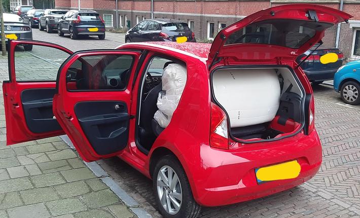 UPDATE: Proof that a rolled up mattress does fit in my compact 'clown' car.