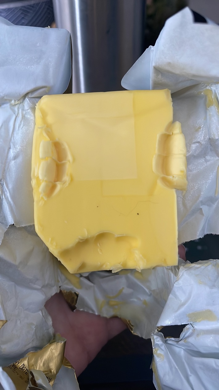 My fiancé and I tested our teeth marks in the butter…neither match. This does confirm someone bit the butter though…