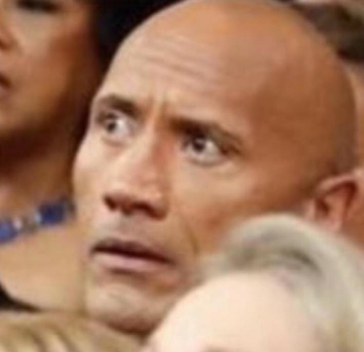 Chris Rock’s cousin, The, looks on in shock as Will Smith approaches the stage.