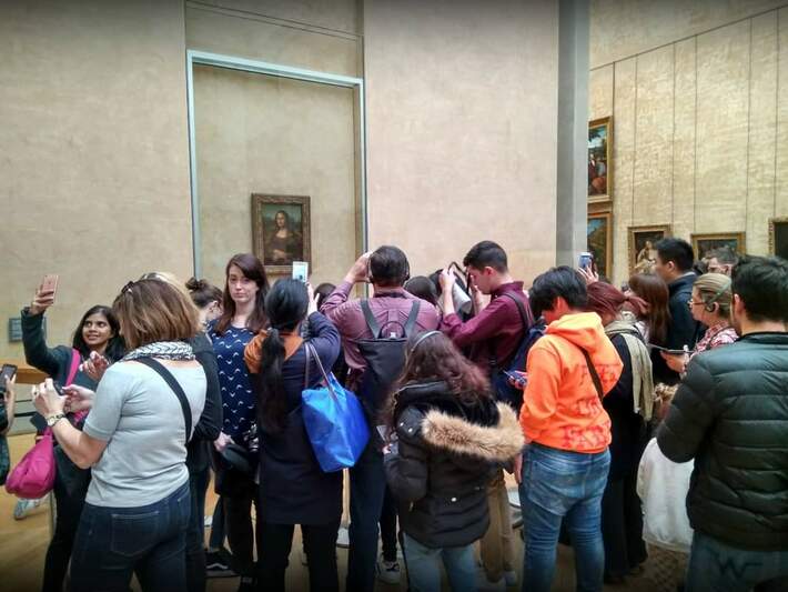 To back up what many people are saying on the "What famous place is not worth visiting?" thread on r/AskReddit, here is my fiancé fulfilling her lifelong dream to see the Mona Lisa in person.