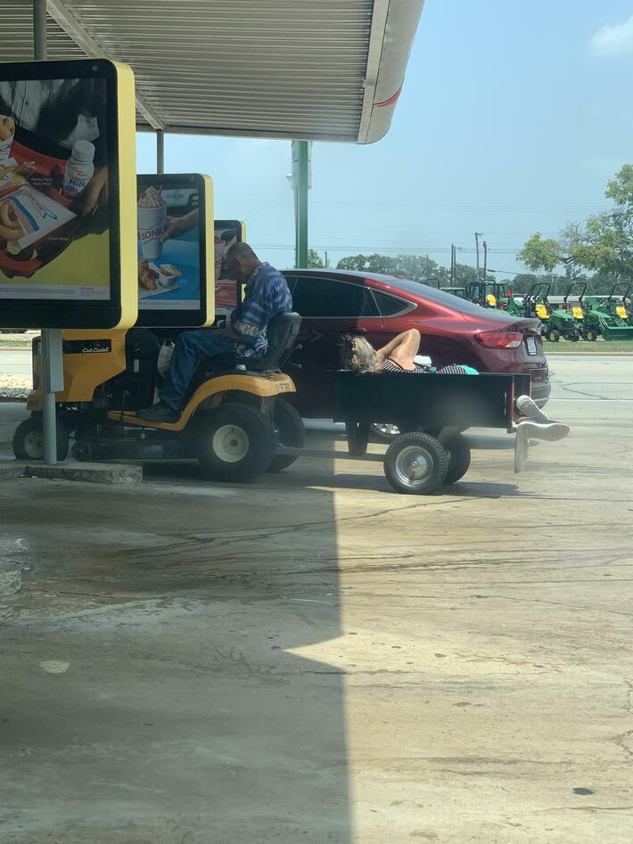 This man towed his wife to sonic on a lawnmower to get a vanilla ice cream cone