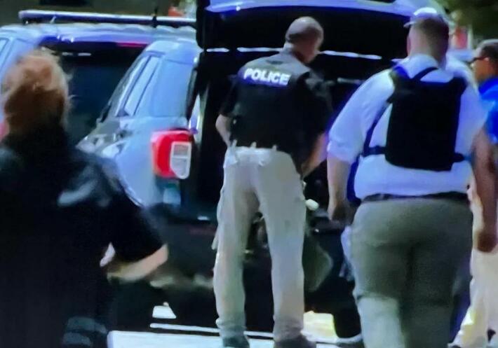 That officer is asking a whole lot out of that bullet proof vest.
