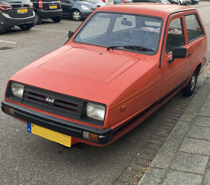 A 3-wheel car with a 4x4 badge