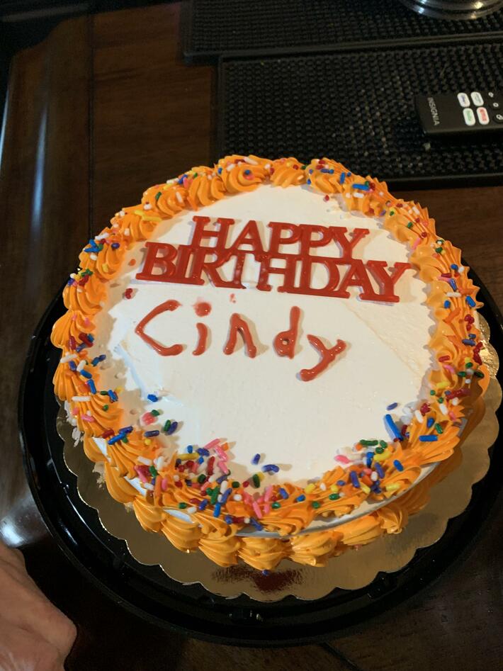 Neighbor purchased generic birthday cake for his wife. Asked the deli lady if she could put her name on it. She replied “yes, but I’m not the greatest at cake decorating “…she wasn’t kidding….