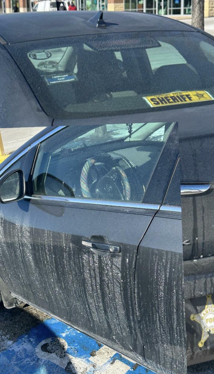Car with bumper stickers saying they support police has a police scanner in the front to avoid police.