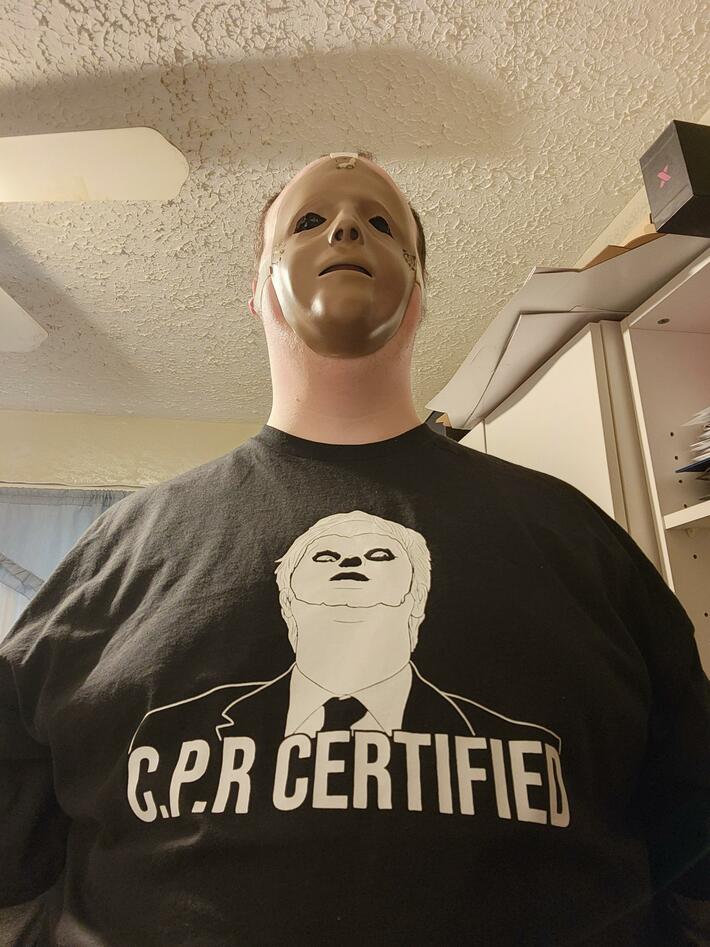 After cutting the face off a CPR doll, my coworkers got me this shirt. [OC]