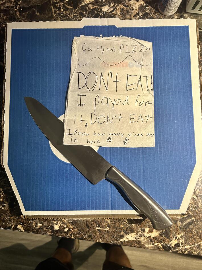 My daughter bought her first pizza with her own money yesterday. Woke up to this this morning. The note says DON’T EAT. The knife says it’s not a suggestion.