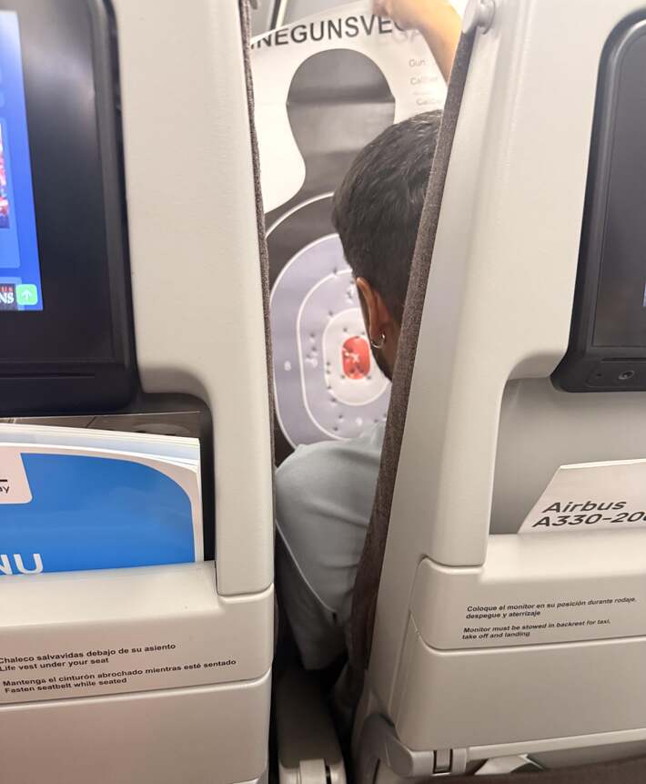 Sitting on a flight so Spain. Couple in front of me carefully unrolled what I assumed was artwork from their American vacation. I am dying 😂